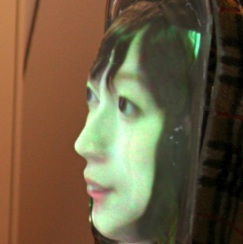 LiveMask: A Telepresence Surrogate System with a Face-shaped Screen